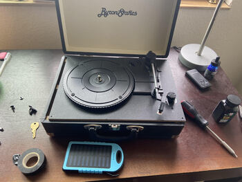 A cheap record player from amazon in the proccess of being disassembled