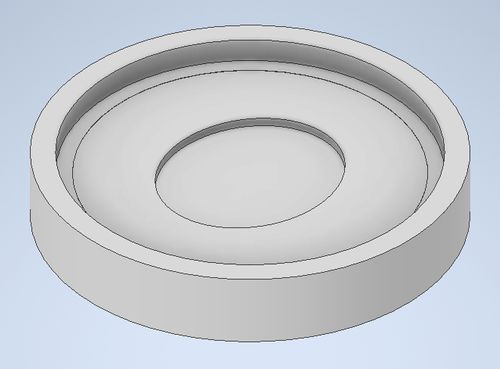 A CAD model of a cylinder with a 1/4'' well, and a 1/2'' well in the middle